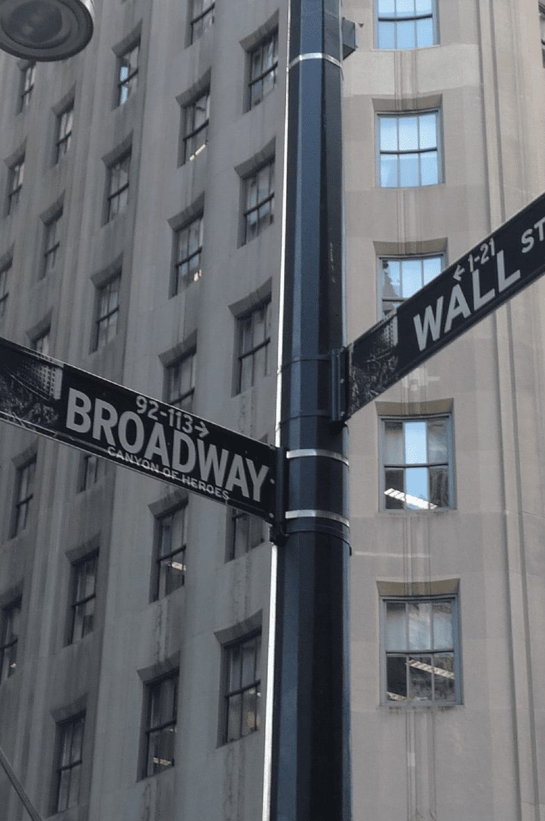 Broadway and Wall Street street signs
